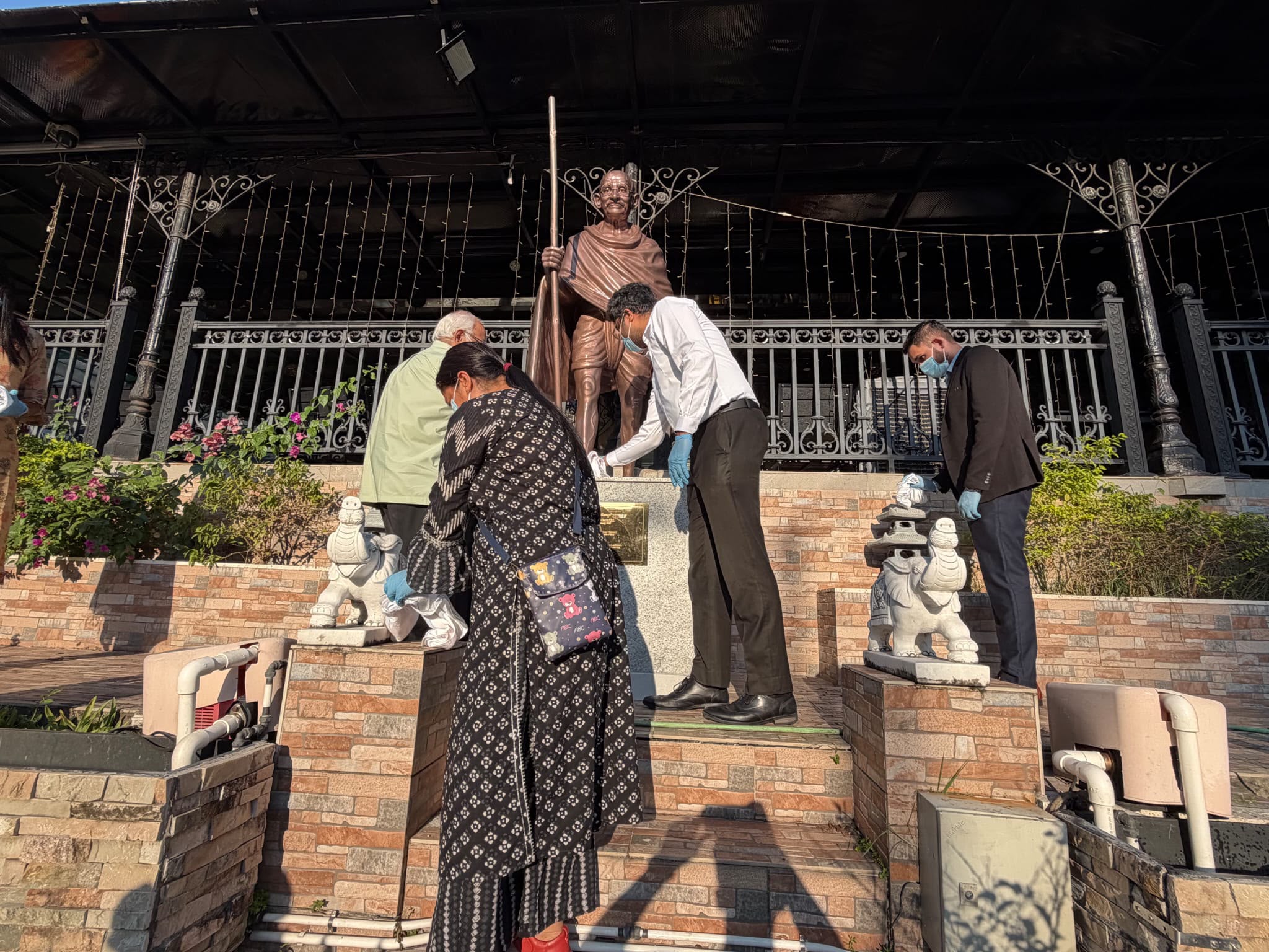 Cleanliness drive around the Mahatma Gandhi statue at India Club, Hong Kong, as part of Seva Pakhwada 